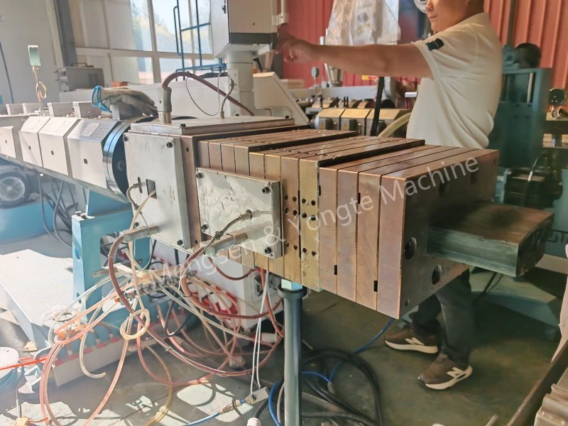 Plastic lumber machine